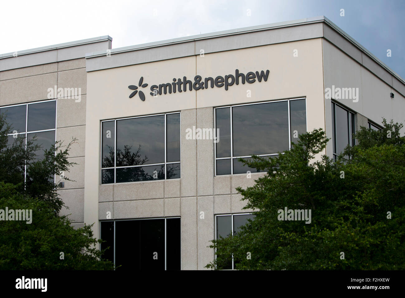 A logo sign outside of a facility occupied by Smith & Nephew in Austin