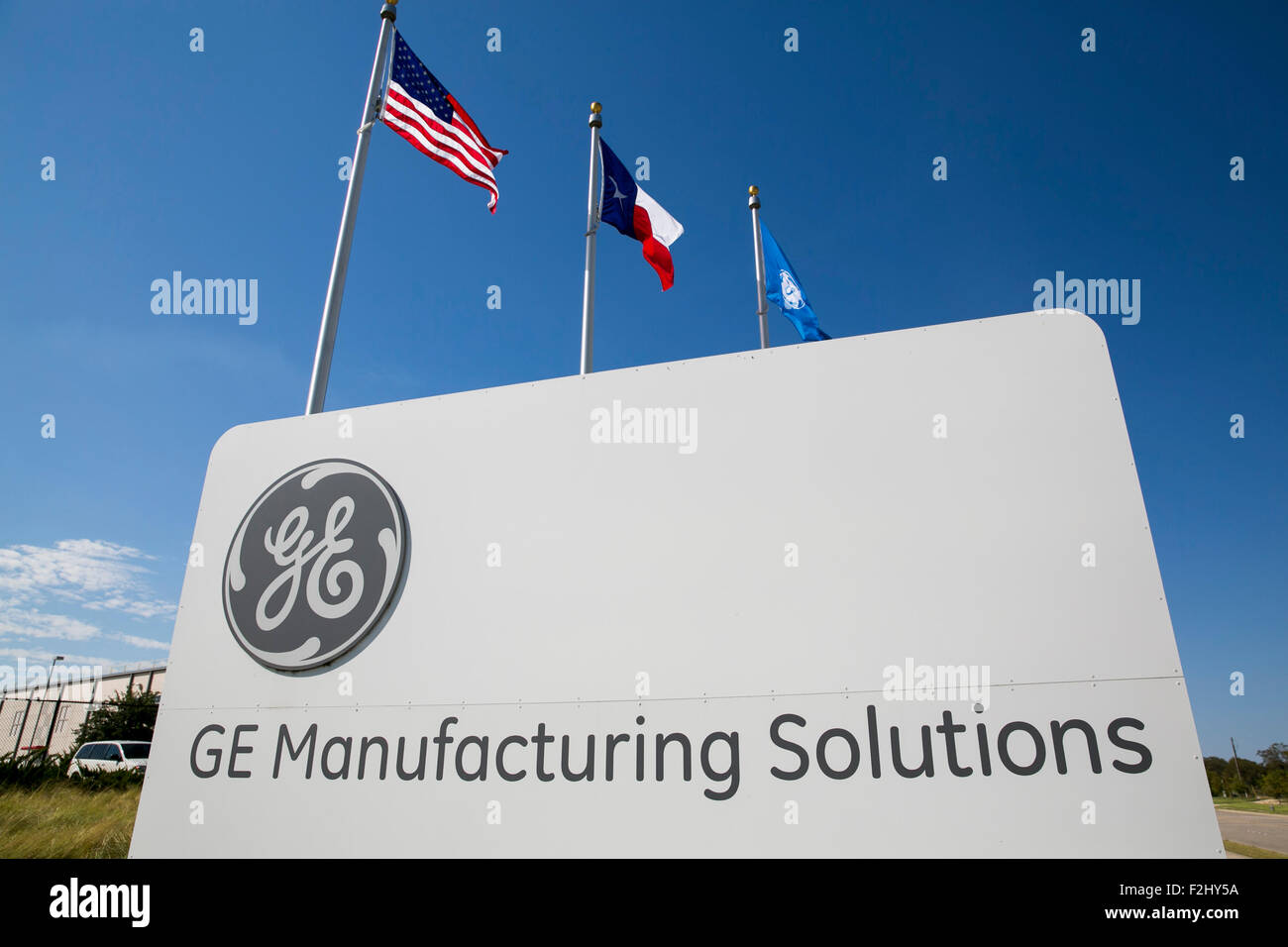 A logo sign outside of a facility occupied by GE (General Electric