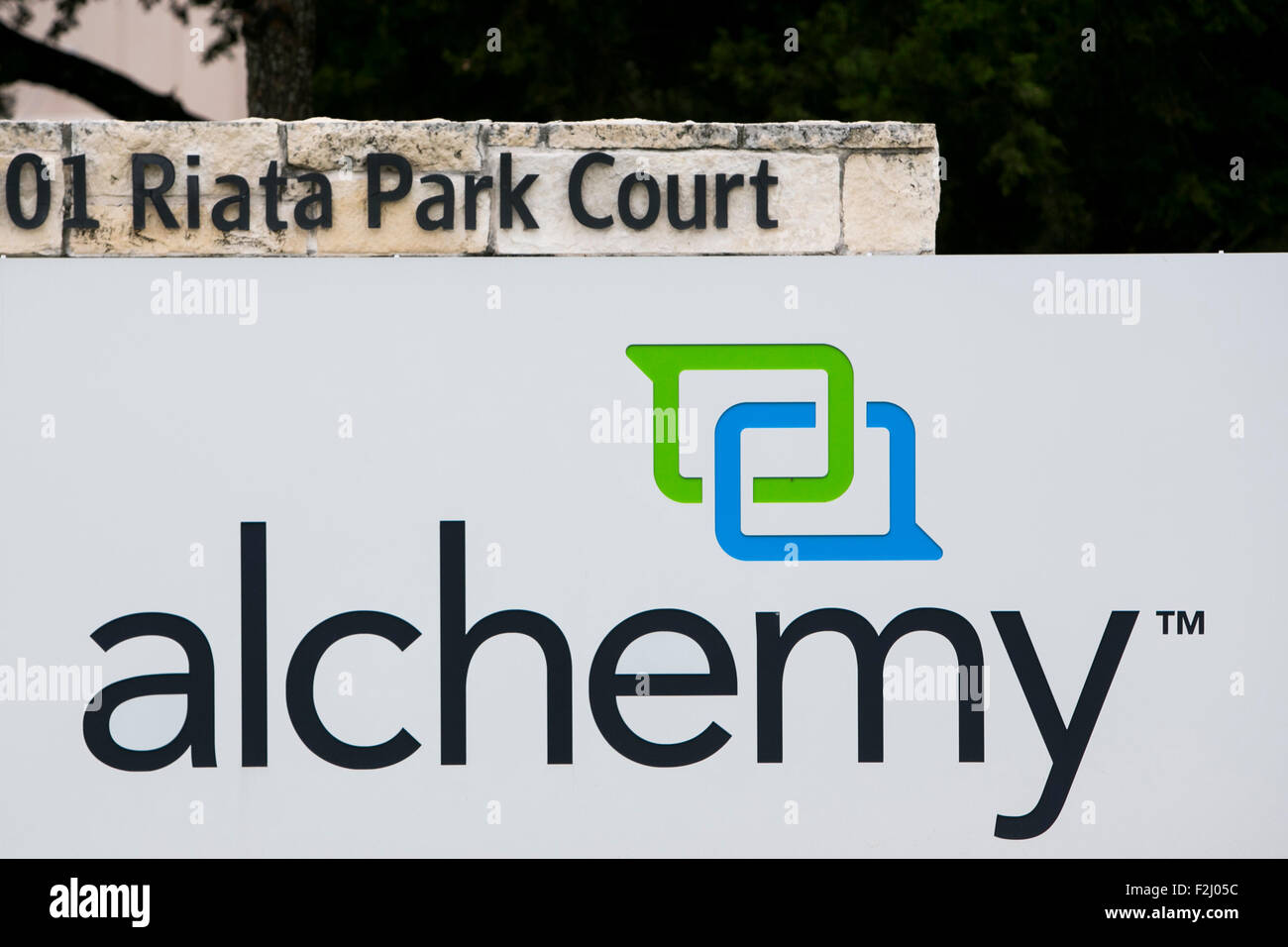 A logo sign outside of the headquarters of Alchemy Systems, LP, in Austin, Texas on September 11, 2015. Stock Photo