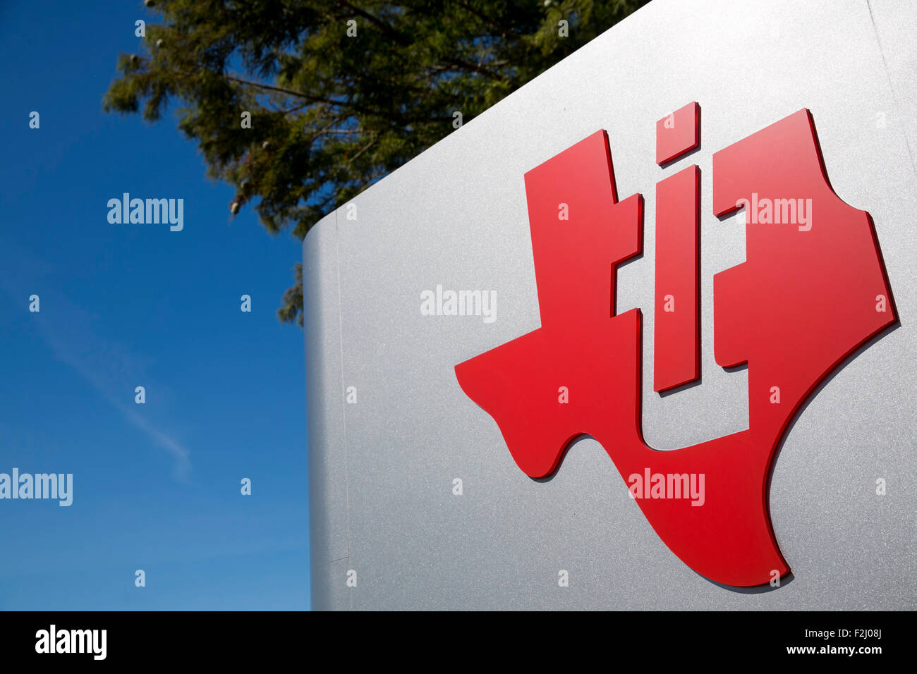A logo sign outside of the headquarters of Texas Instruments in Dallas, Texas on September 12, 2015. Stock Photo