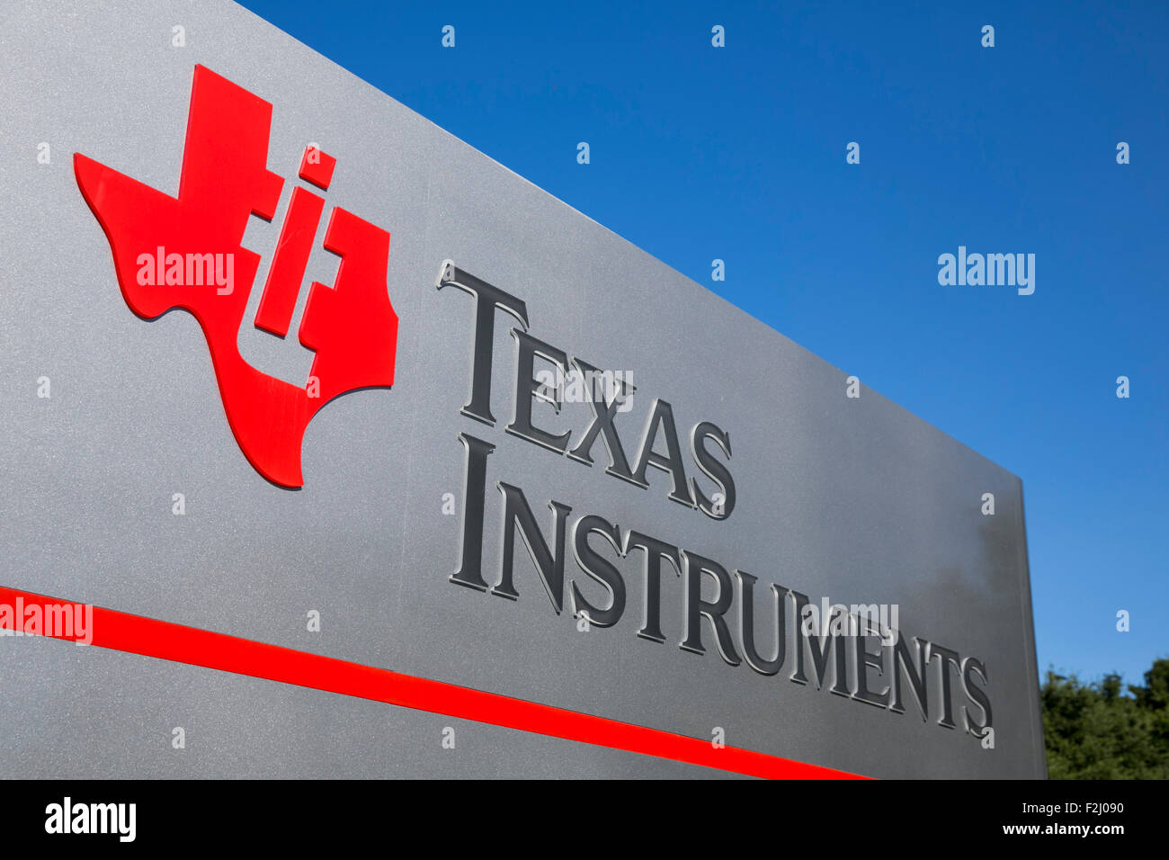 A logo sign outside of the headquarters of Texas Instruments in Dallas