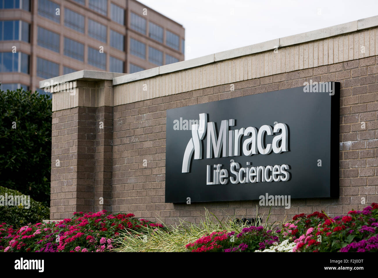 A logo sign outside of the headquarters of Miraca Life Sciences in ...