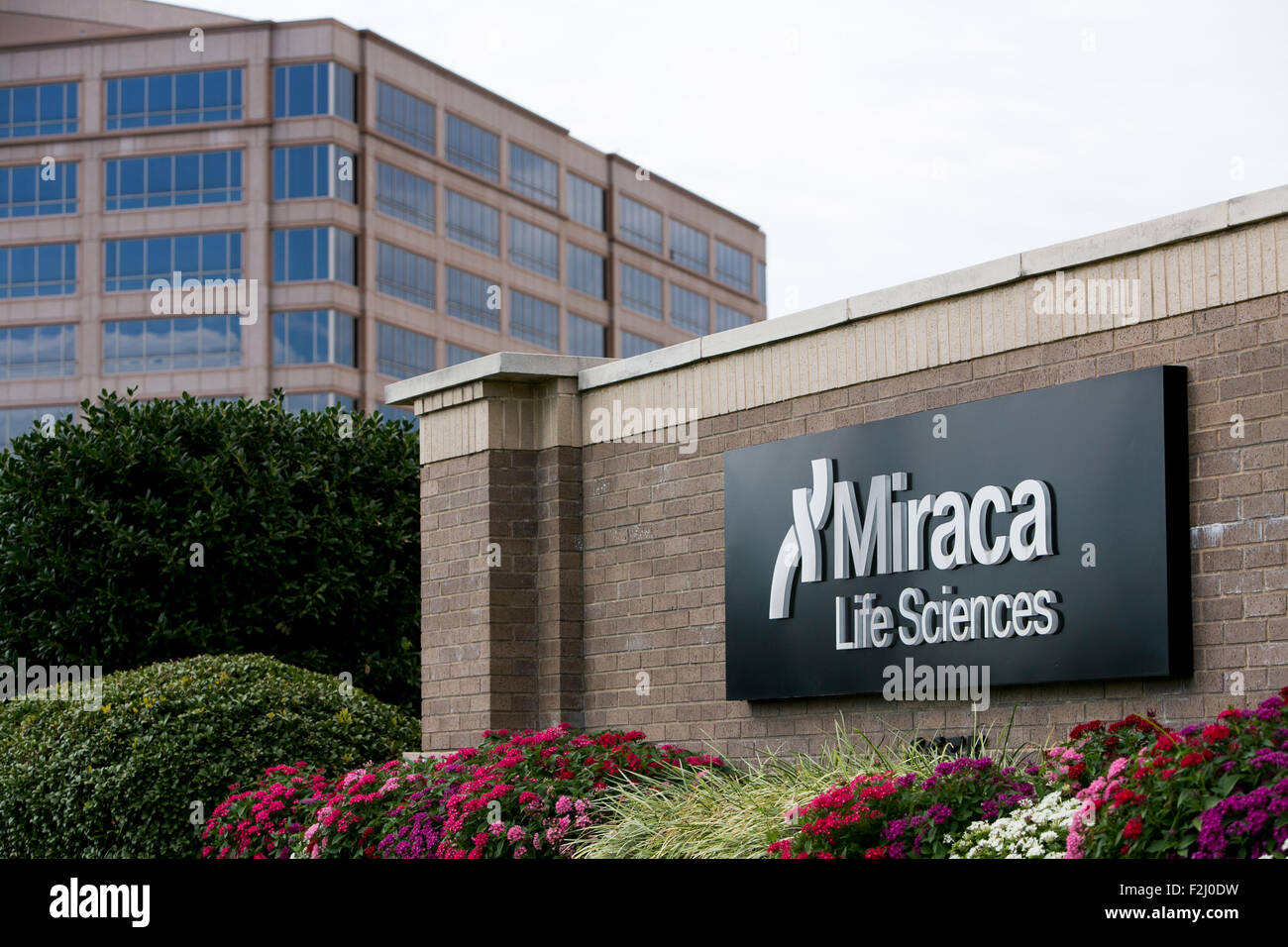 A logo sign outside of the headquarters of Miraca Life Sciences in ...