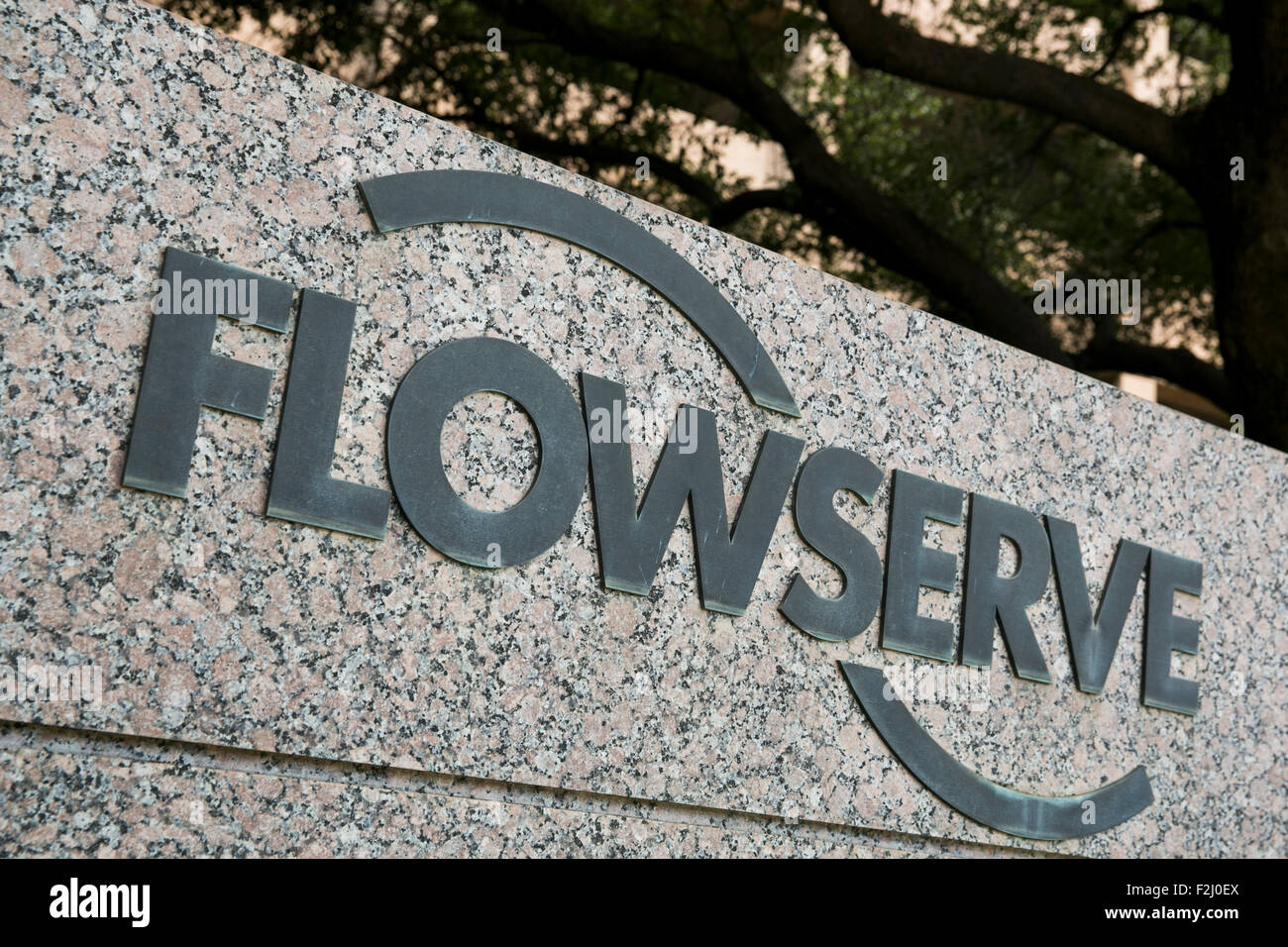 A logo sign outside of the headquarters of The Flowserve Corporation in