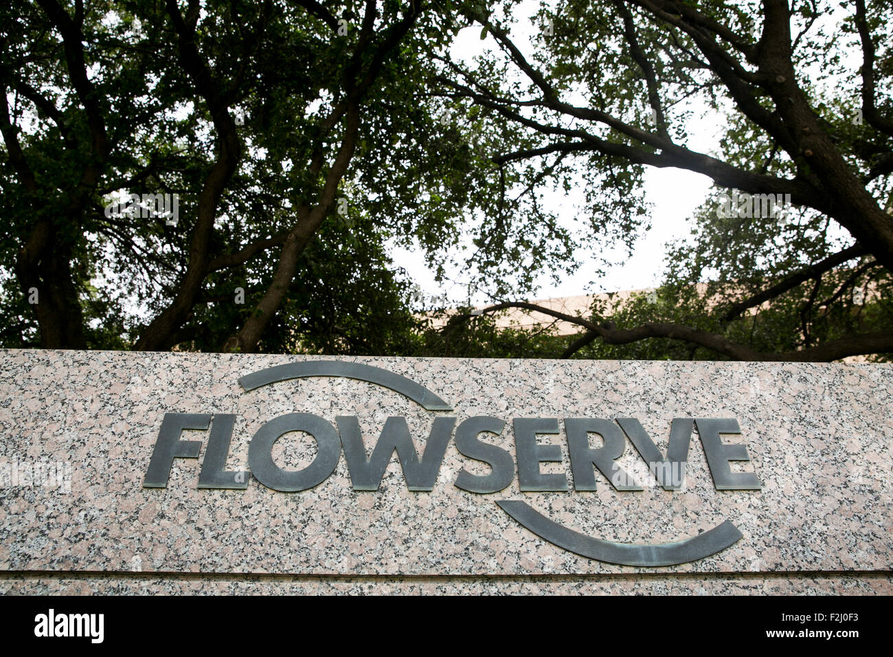 A logo sign outside of the headquarters of The Flowserve Corporation in