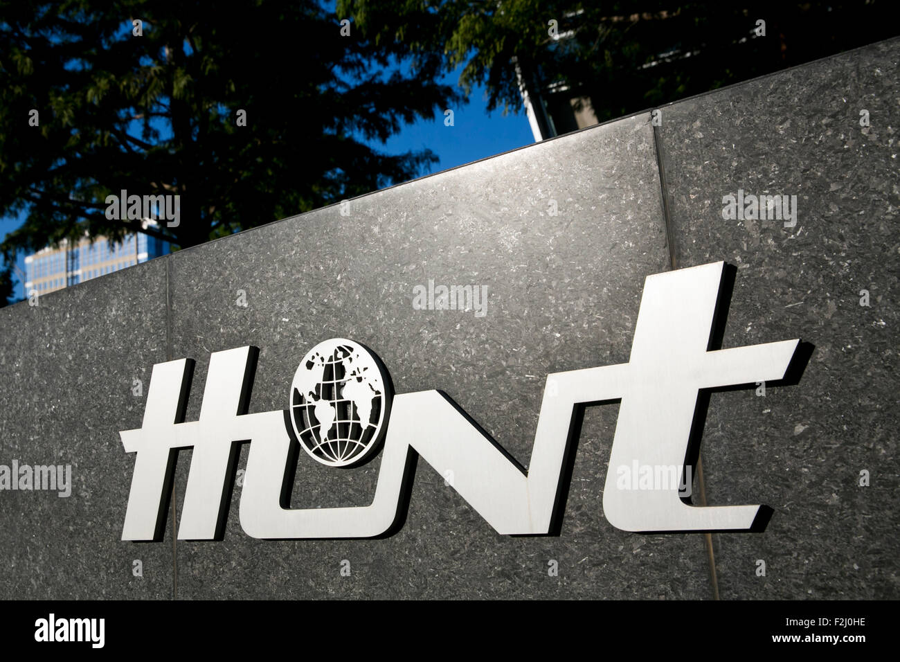A logo sign outside of the headquarters of the Hunt Oil Company in