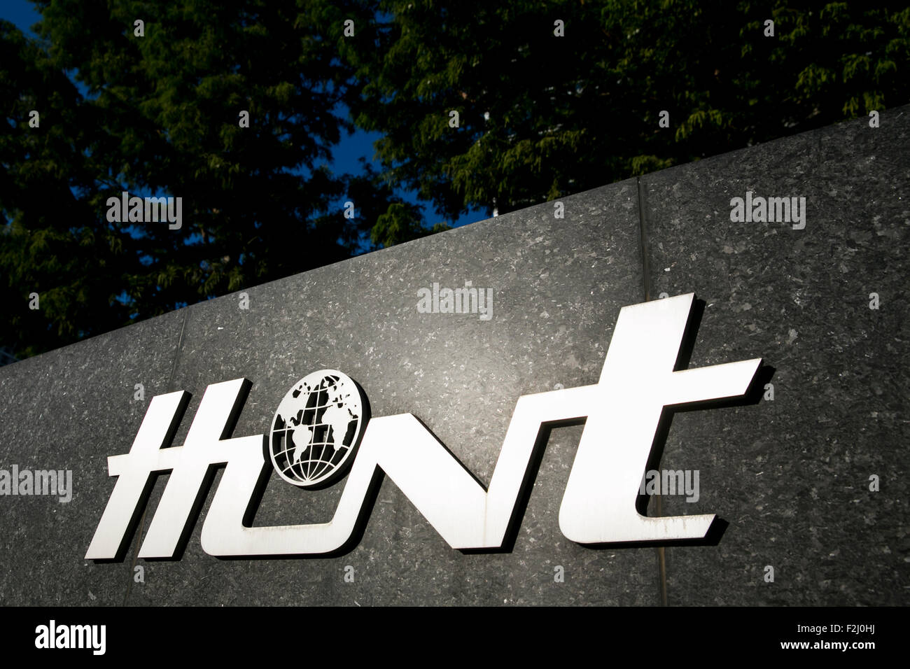 A logo sign outside of the headquarters of the Hunt Oil Company in