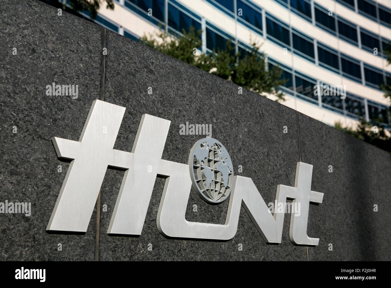 A logo sign outside of the headquarters of the Hunt Oil Company in Dallas, Texas on September 13, 2015. Stock Photo
