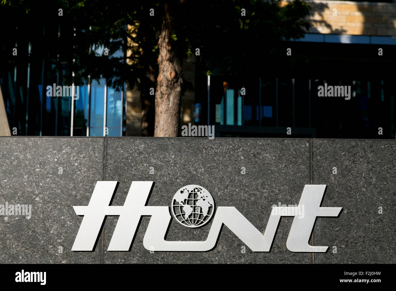 A logo sign outside of the headquarters of the Hunt Oil Company in Dallas, Texas on September 13, 2015. Stock Photo