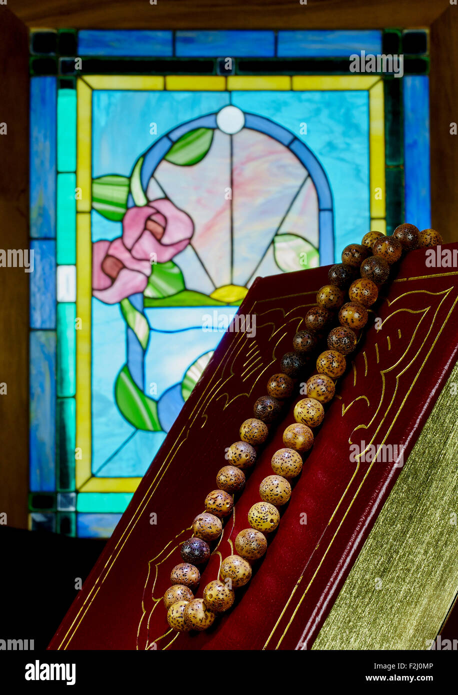 Stained Glass Window with Prayer Beads and Vintage Book Stock Photo Alamy