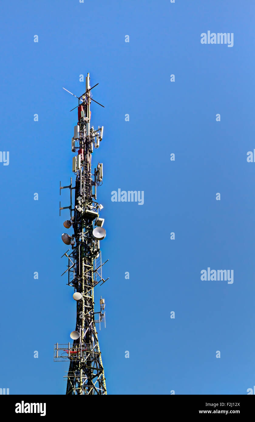 Telecommunications antennas are essential components of all equipment that uses radio transmission. Stock Photo