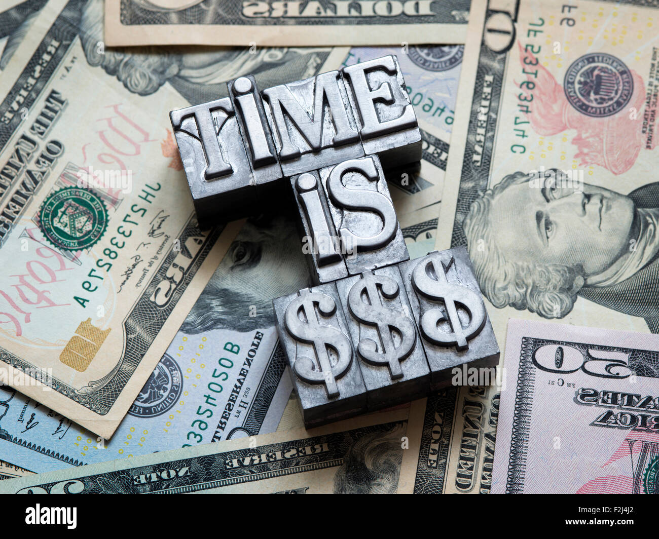 Time Is Money Concept Made From Metallic Letterpress Type On Heap Of Stock Photo Alamy