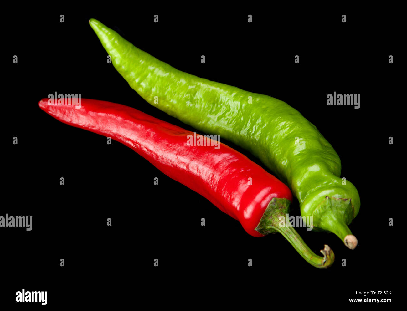 Red and green chili pepper isolated on black Stock Photo
