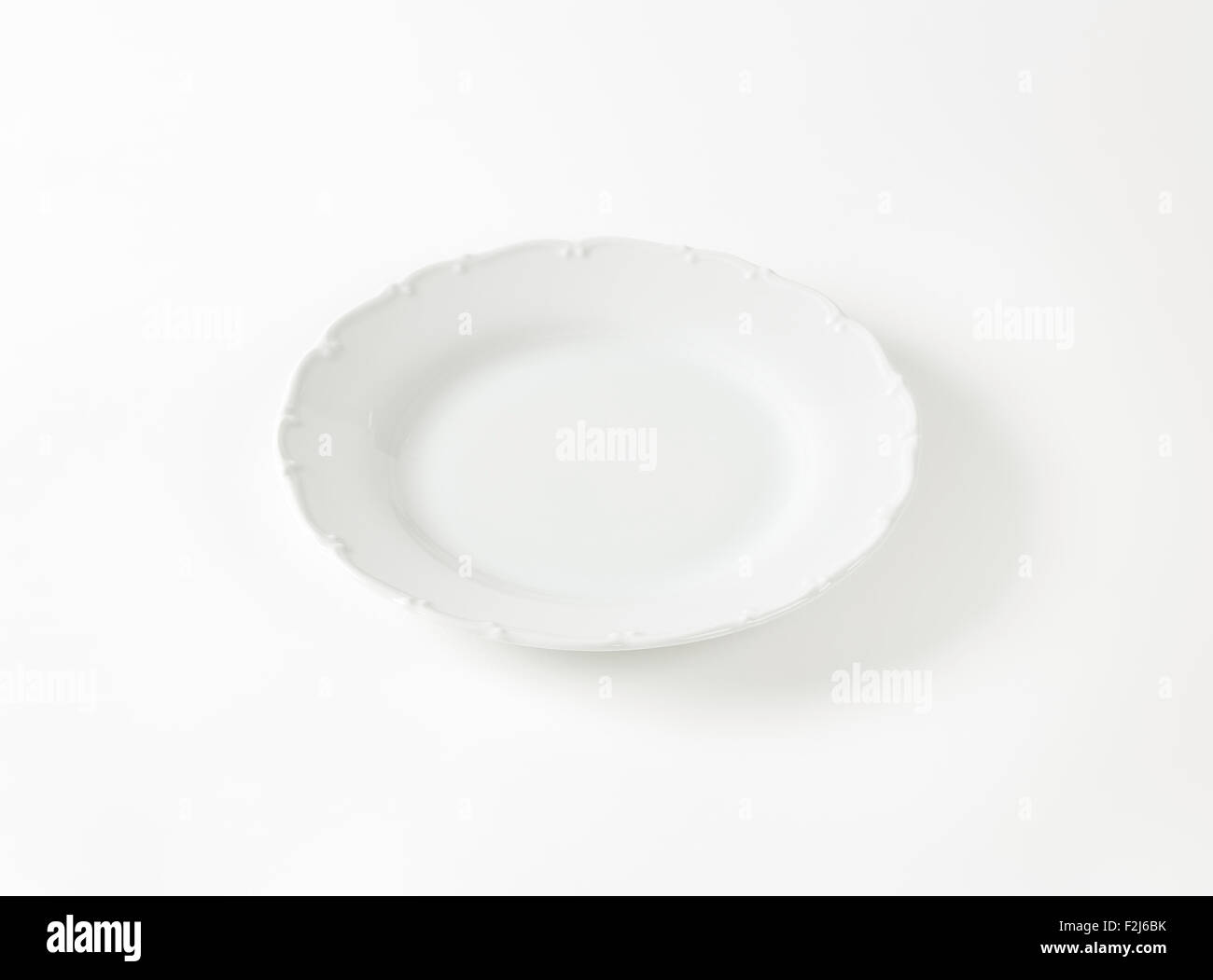 white decorative plate on white background Stock Photo Alamy