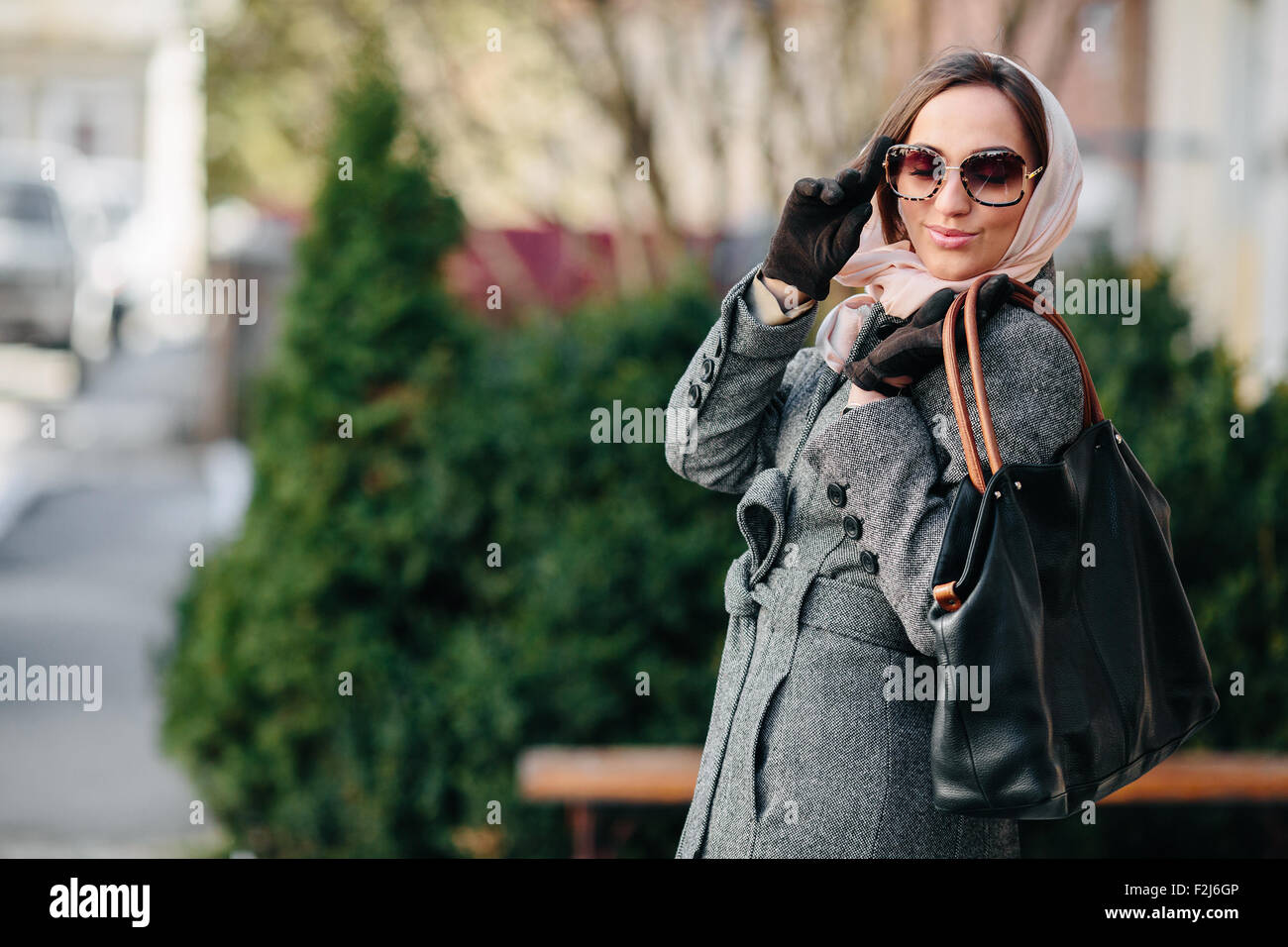 Happy young beautiful girl posing in the park Stock Photo - Alamy
