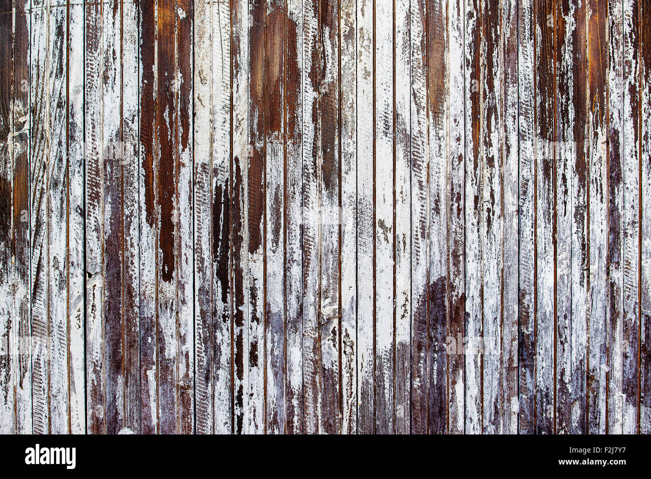 Old rustic wooden plank wall painted white, paint peel texture Stock Photo