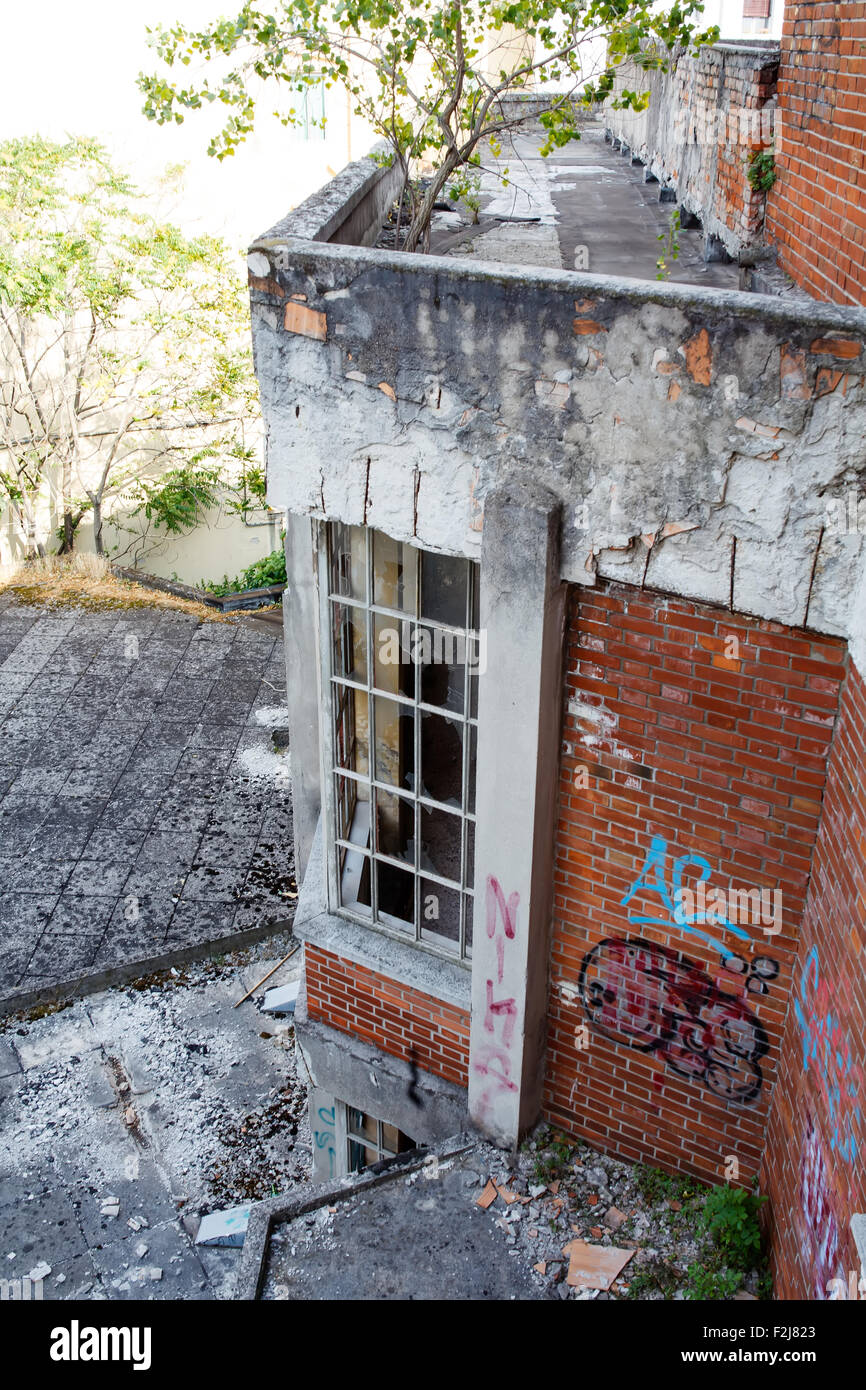 View of broken windows of abandoned building Stock Photo - Alamy