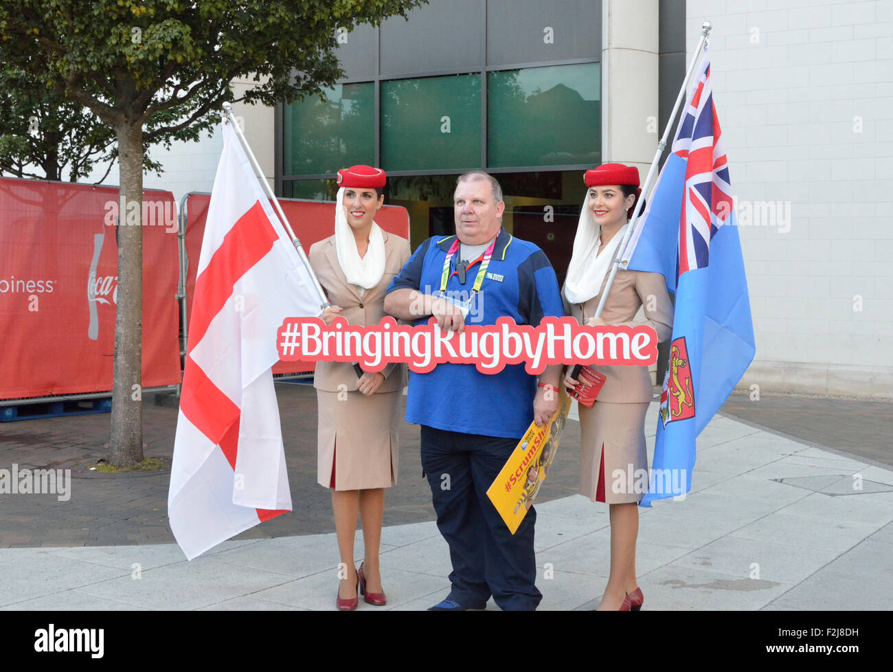 Rugby supporter at the 2015 world Cup in Twickenham, England with Emirates Air hostesses stewardesses Stock Photo