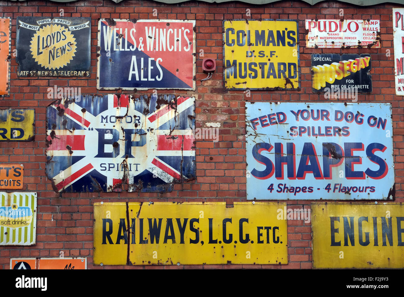 Vintage enamel advertising signs at Bygone Times antiques centre, Eccleston, Chorley, , Lancashire, England UK Stock Photo