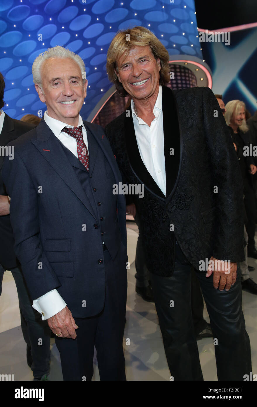 Berlin, Germany. 19th Sep, 2015. Austrian singer Hansi Hinterseer (R) poses with British musician Tony Christie after the television show 'Willkommen bei Carmen Nebel' (lit. Welcome at Carmen Nebel's) of German public broadcaster ZDF in Berlin, Germany, 19 September 2015. Photo: Joerg Carstensen/dpa/Alamy Live News Stock Photo