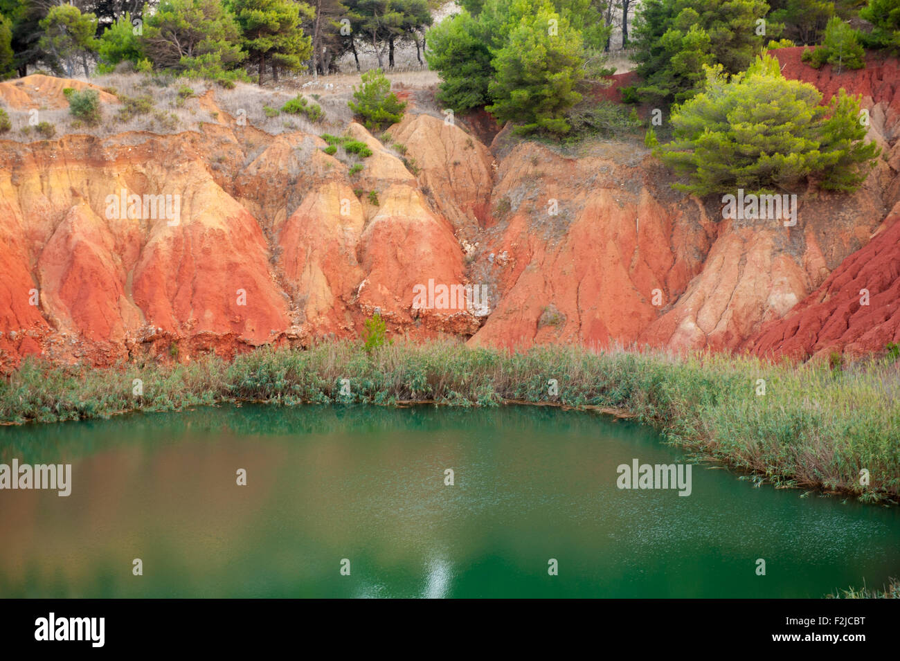 Bauxite mine lake landscape, scenic red colors Stock Photo Alamy