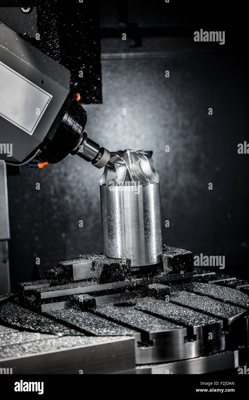 Metalworking CNC milling machine. Cutting metal modern processing technology. Small depth of field. Warning - authentic shooting Stock Photo
