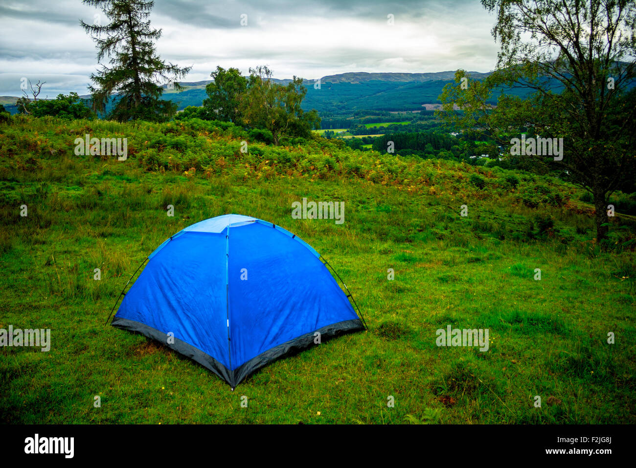 Tent on a hillside Stock Photo - Alamy