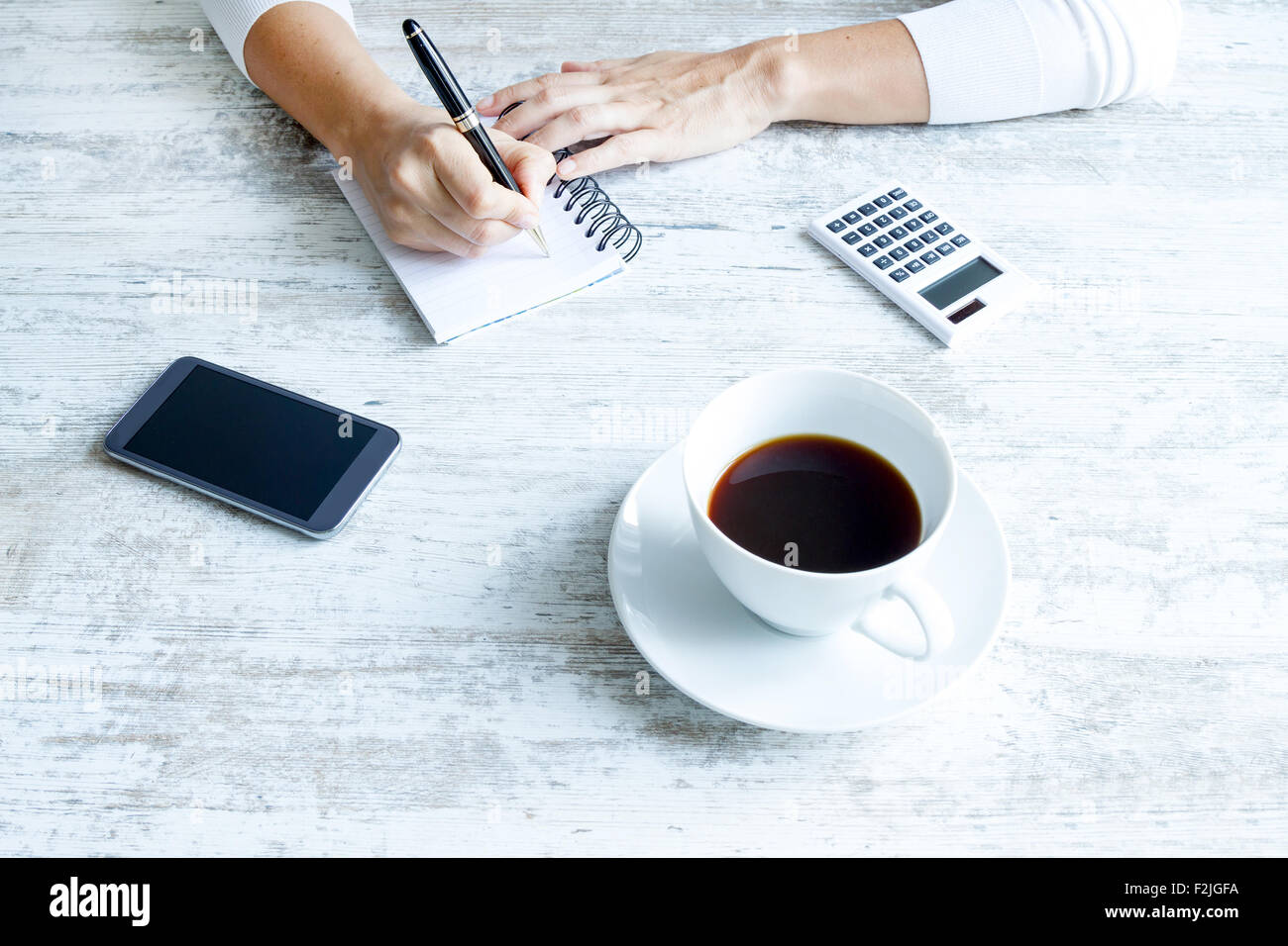 Taking some notes at the office Stock Photo - Alamy