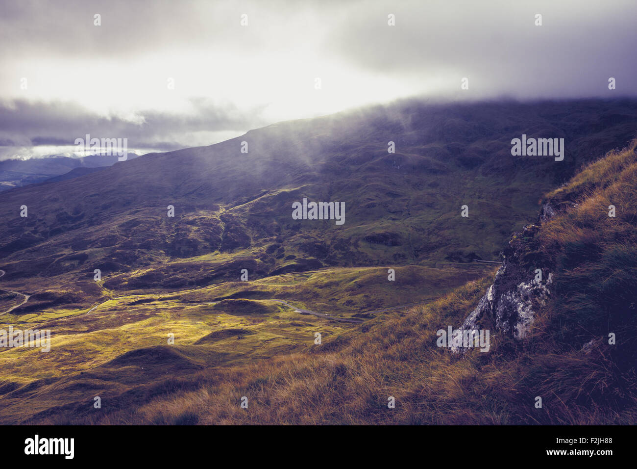 Misty landscape with mountains Stock Photo - Alamy