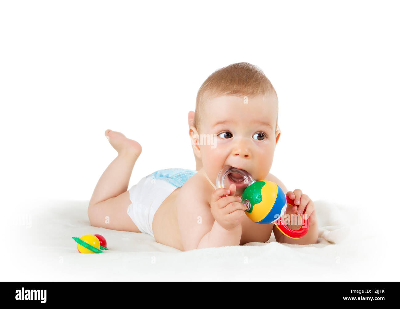 Baby holding a toy Stock Photo