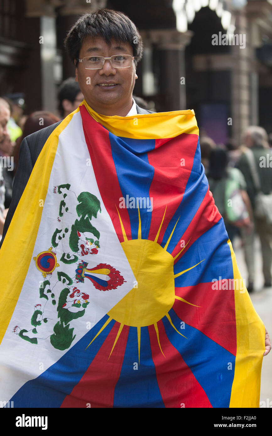 London, UK. 20th September, 2015. Supporters of the Dalai Lama wait for his arrival in St Martin's Lane. On the occation of His Holiness the 14th Dalai Lama giving a talk about 'Ahmisa - India's Contribution to the World' at the London Coliseum, supporters of His Holiness and protesters from the International Shugden Community gathered in St. Martin's Lane.  Credit:  Vibrant Pictures/Alamy Live News Stock Photo