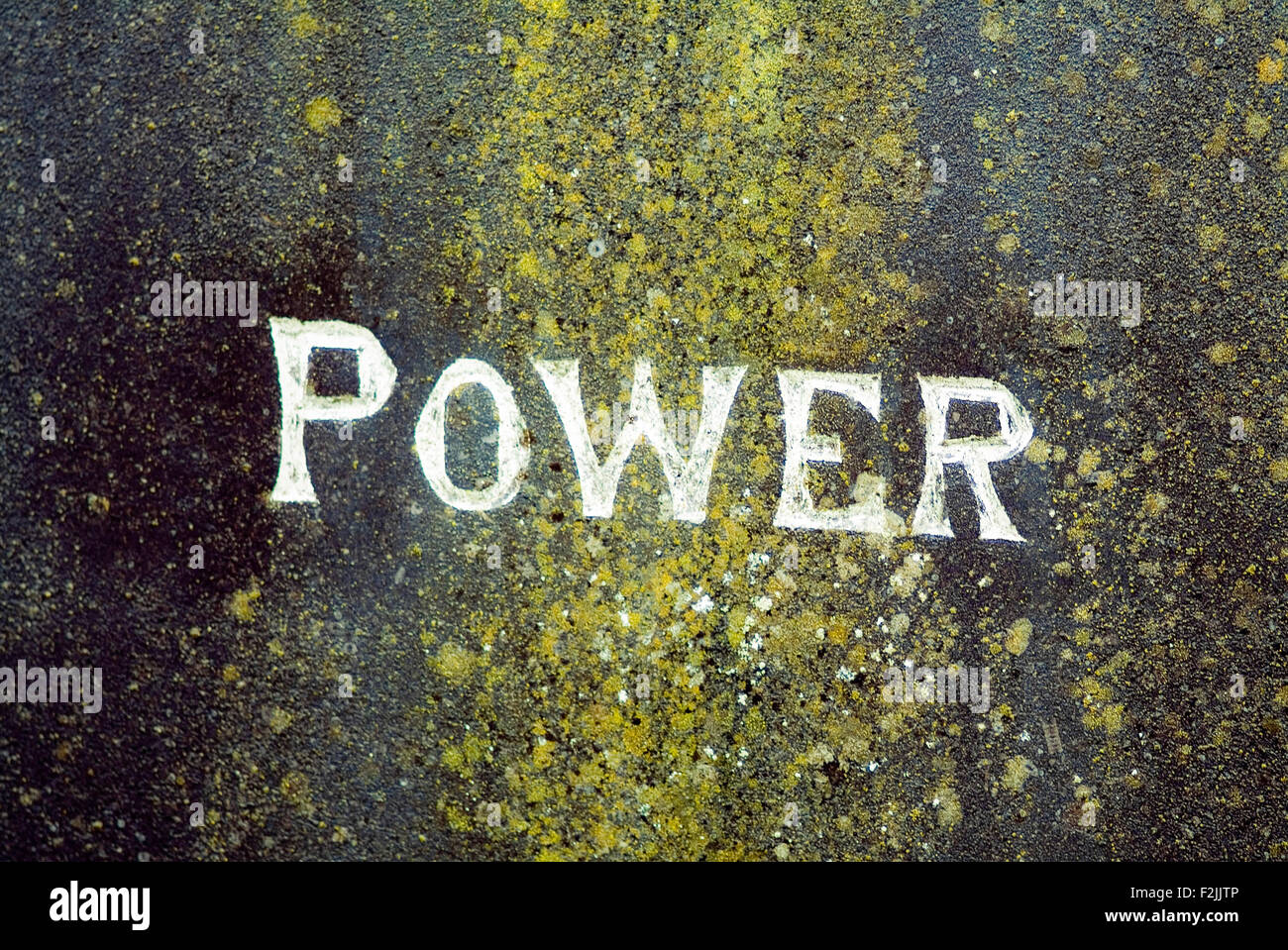 Writing power on a gravestone cemetary blurred zoomed in ireland Stock Photo