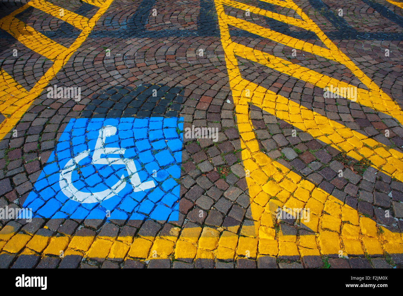 Parking for cars and signal for the disabled Stock Photo