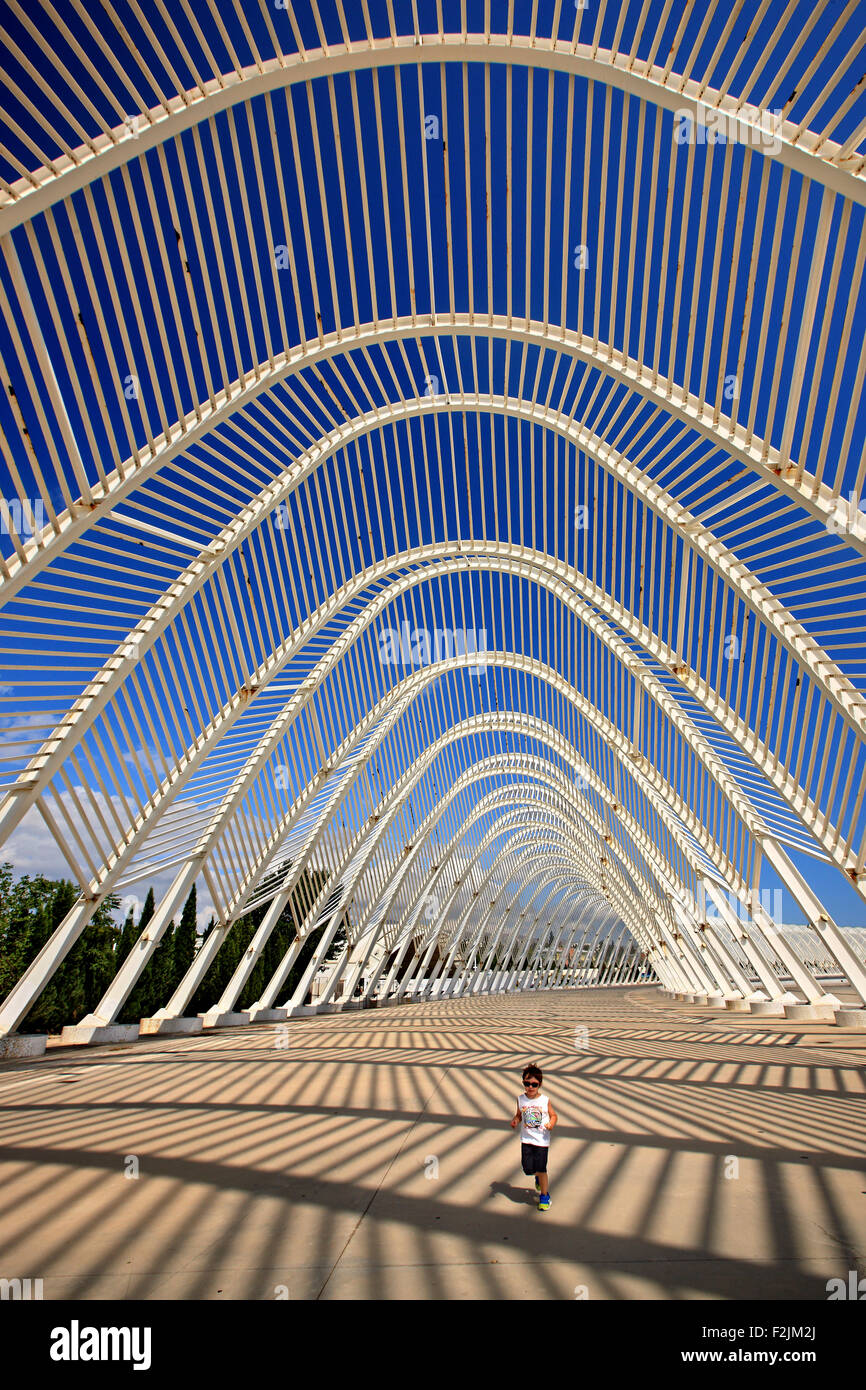 Little boy running in the "Agora" at the Olympic complex of Athens, where the 2004 Olympic Games, took place. Stock Photo