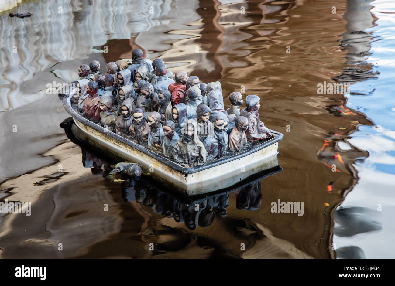 Drive The Boats Amusement At Banksy S Dismaland In Weston Super Mare With Refugees And Immigrants Crowded Into The Boats Stock Photo Alamy