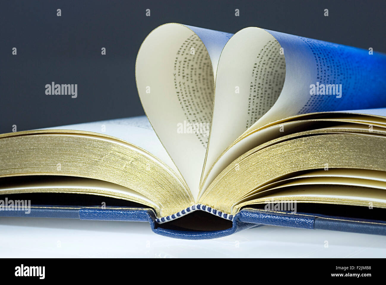 Open book, two pages folded into the shape of a heart Stock Photo