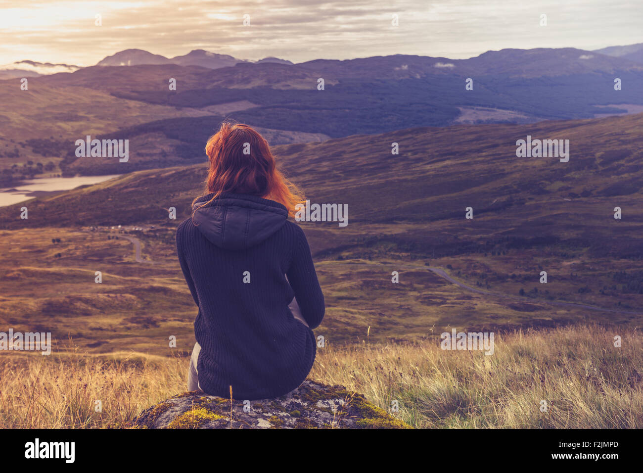Sitting on mountain top hi-res stock photography and images - Alamy