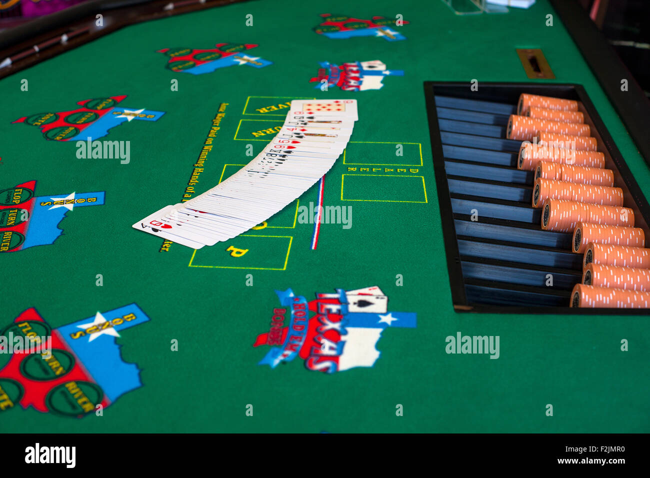 French cards for Texas hold 'em ion casino table Stock Photo Alamy