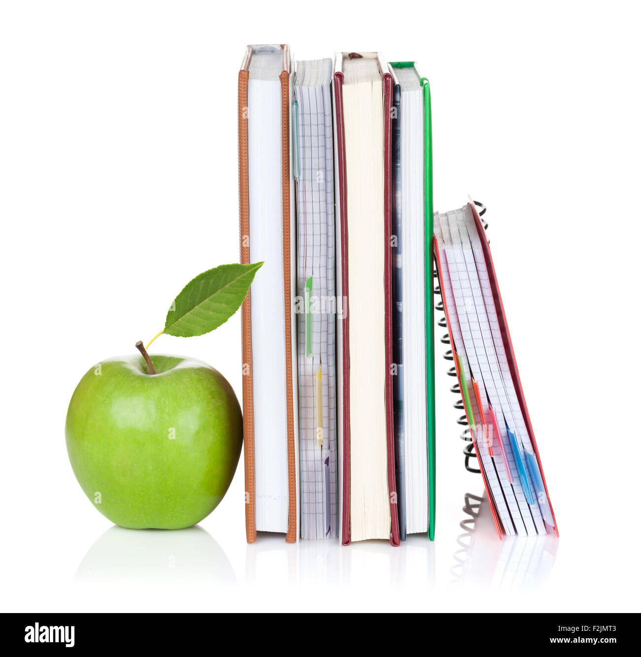 School and office supplies. Notepads and apple. Isolated on white background Stock Photo