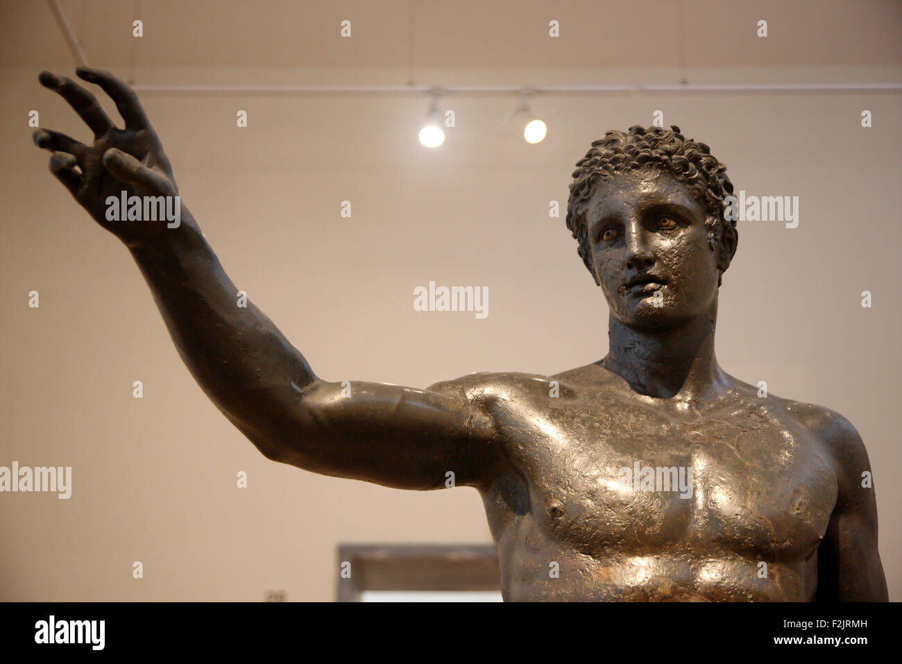 Bronze statue of a youth from the Antikythera shipwreck (340-330 BC) in the National Archaelogical Museum, Athens, Greece. Stock Photo