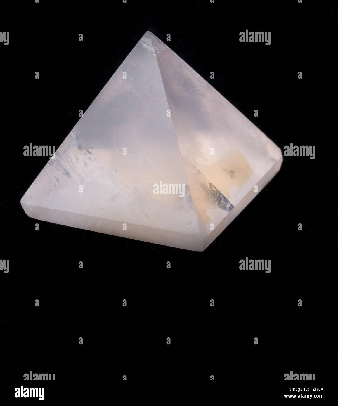 Rose quartz pyramid isolated Stock Photo