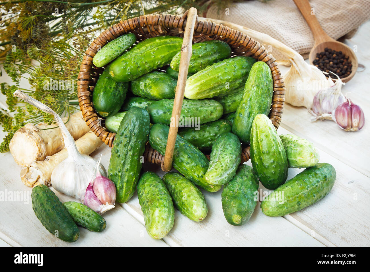 Ripe cucumbers in small basket Stock Photo