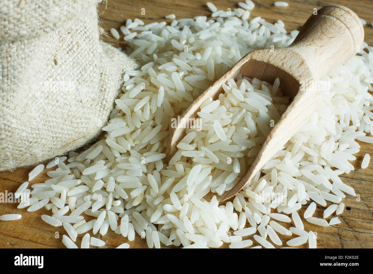 Rice on wooden spoon Stock Photo
