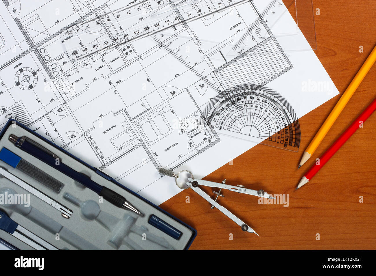 Architectural plans, pencils and ruler on the desk Stock Photo