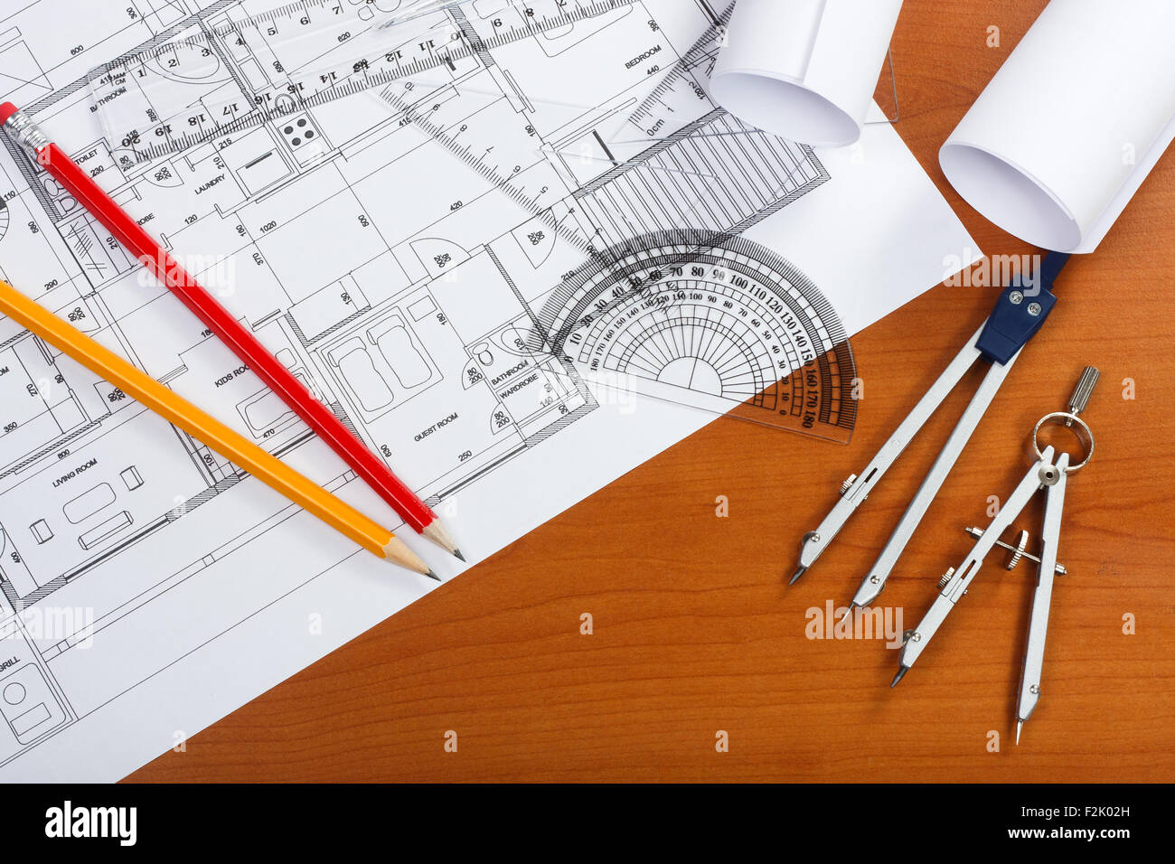 Architectural plans, pencils and ruler on the desk Stock Photo