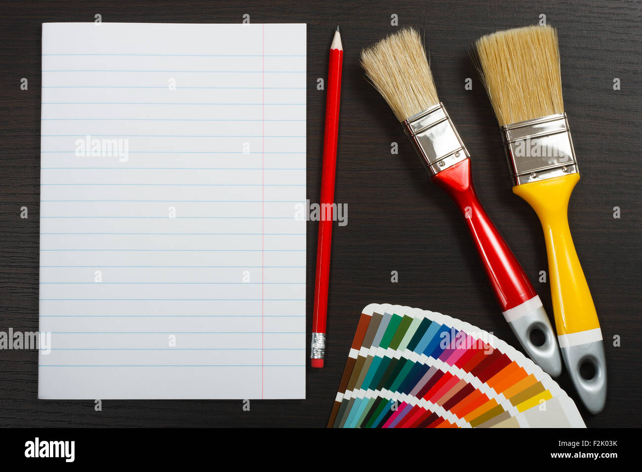 Preparing to painting. Blank white paper and pencil on a wooden desk Stock Photo