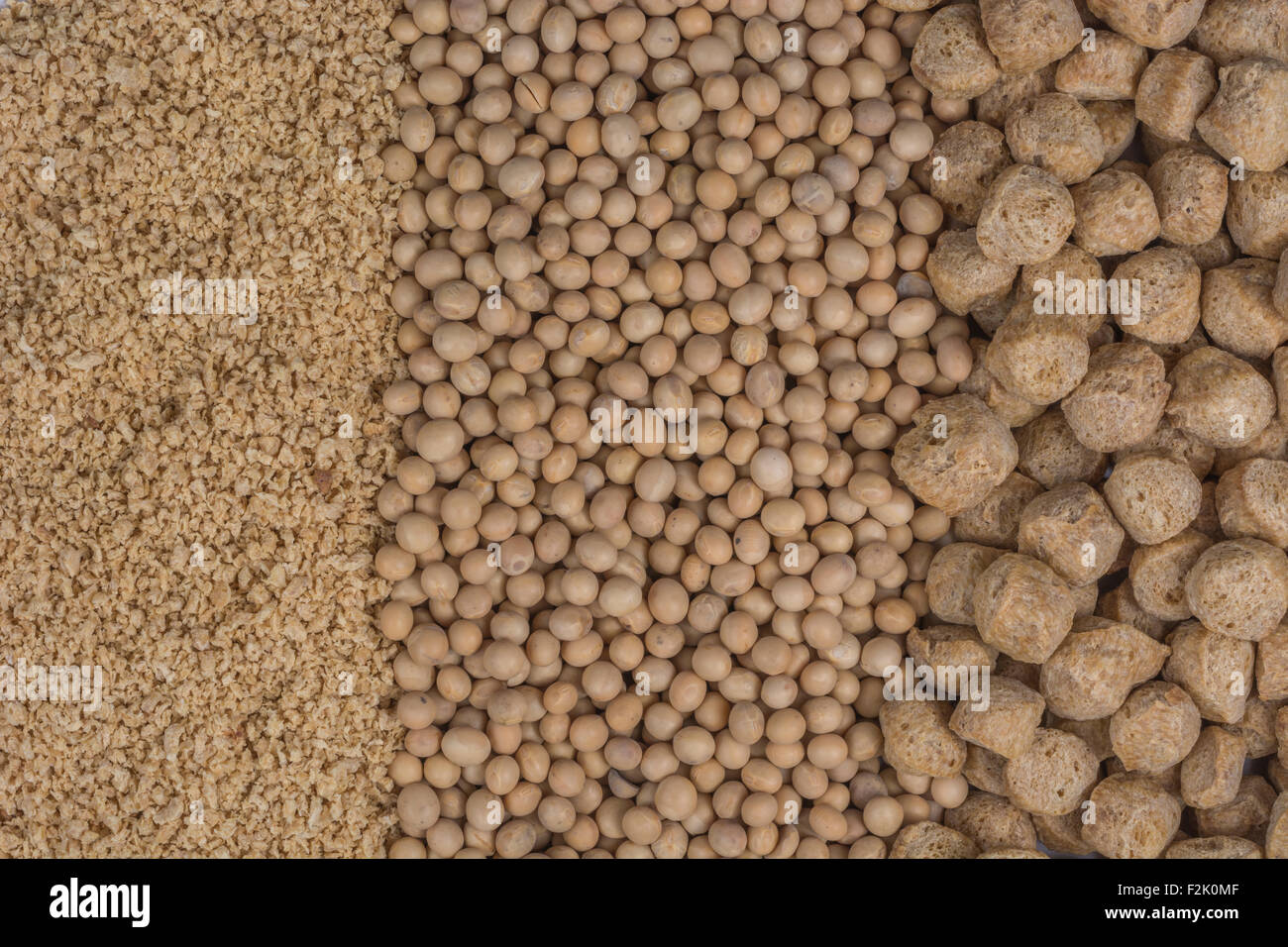 Closeup dried soy / soya beans, soy bean meal, and bean chunks used