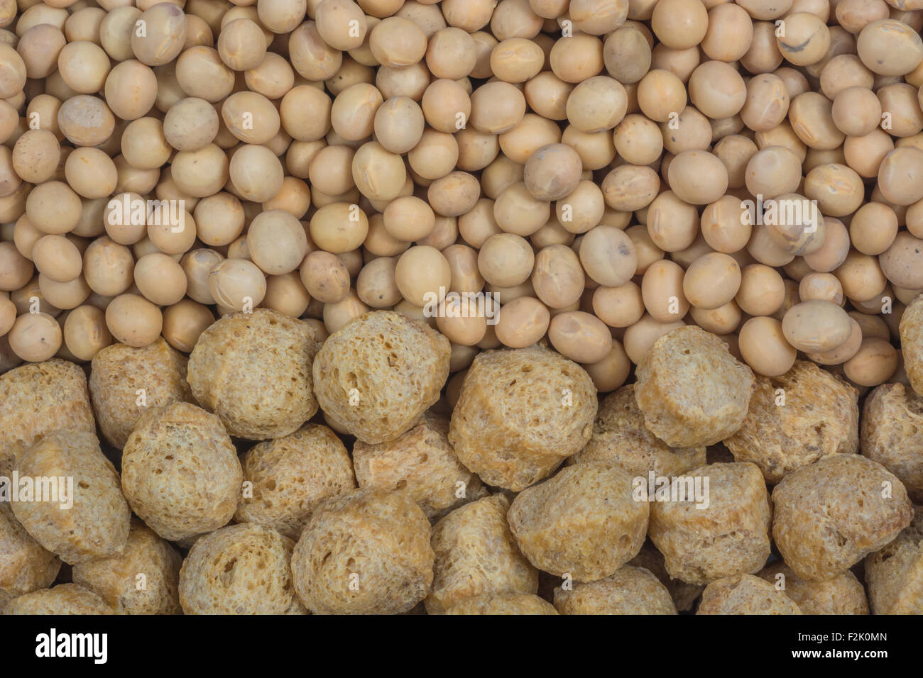 Close-up dried soy / soya beans and soy bean chunks. Used in vegetarian food / cookery. Concept US-China trade tariff war, Soybean products. Stock Photo