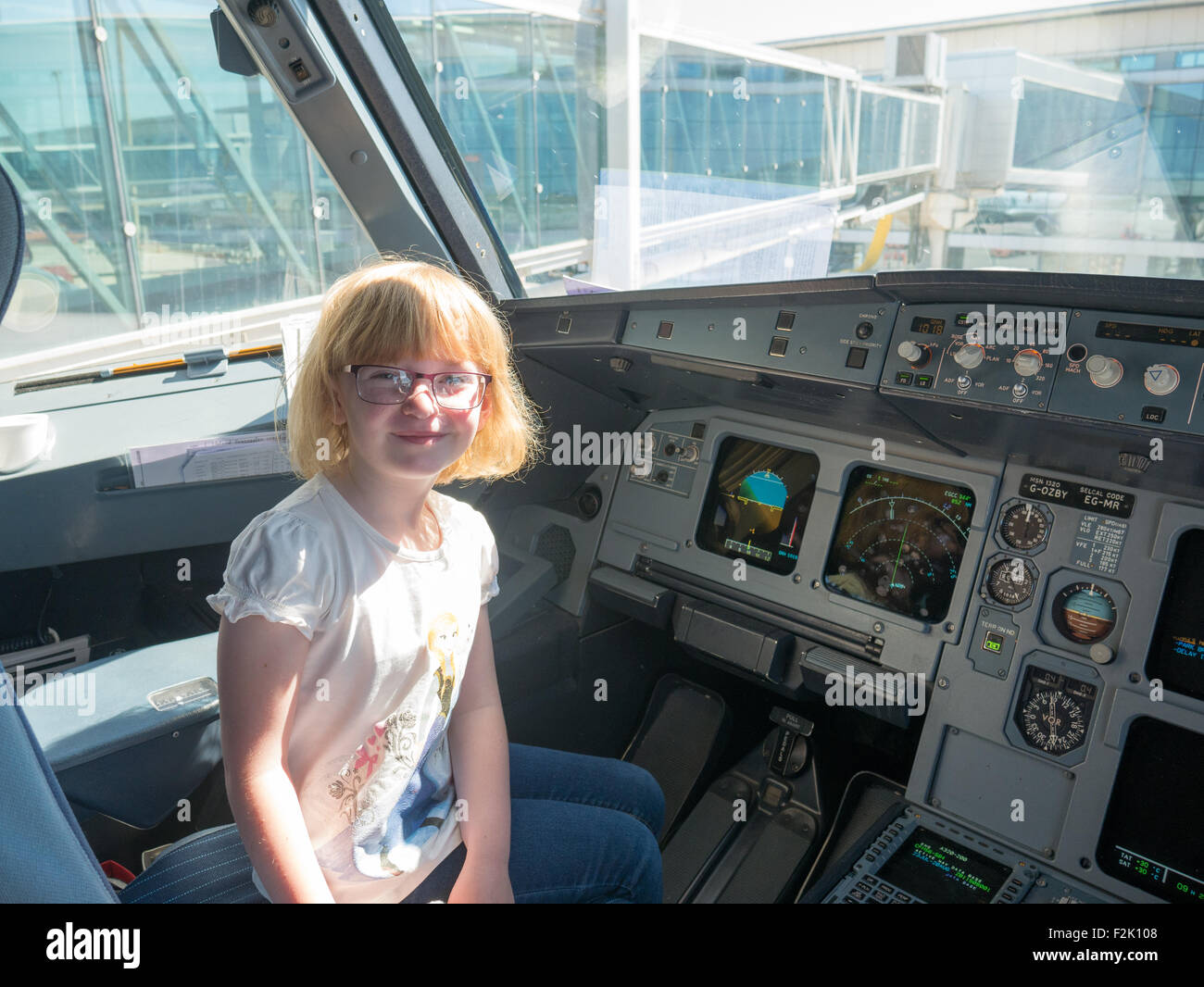 Child in cockpit of aeroplane Stock Photo