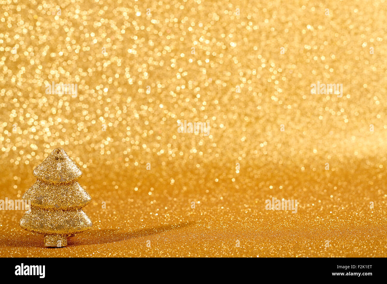 Golden christmas fir tree decoration on glitter background Stock Photo ...